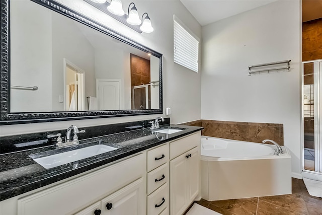 bathroom with independent shower and bath, vanity, and tile patterned floors