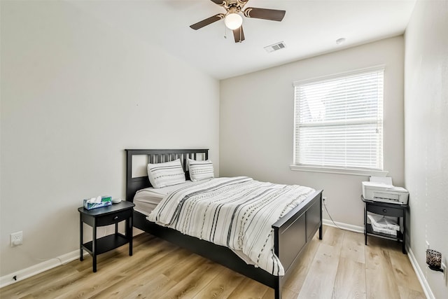 bedroom featuring ceiling fan and light hardwood / wood-style flooring