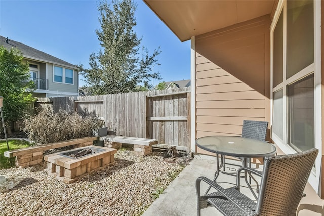 view of patio / terrace featuring an outdoor fire pit