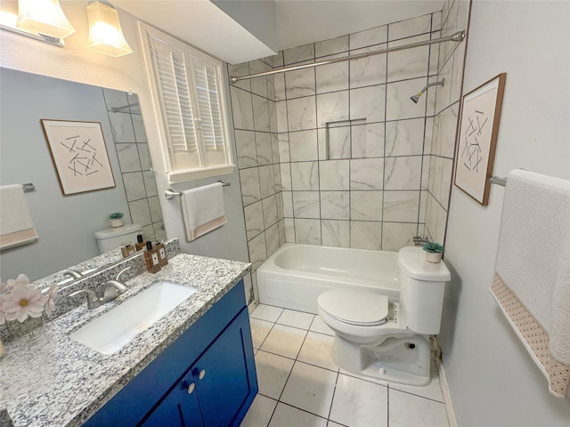 full bathroom featuring tiled shower / bath combo, vanity, tile patterned floors, and toilet