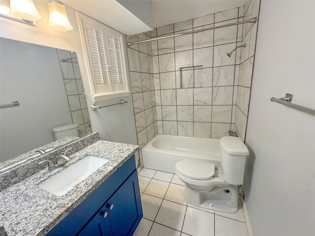 full bathroom featuring vanity, toilet, and tiled shower / bath combo