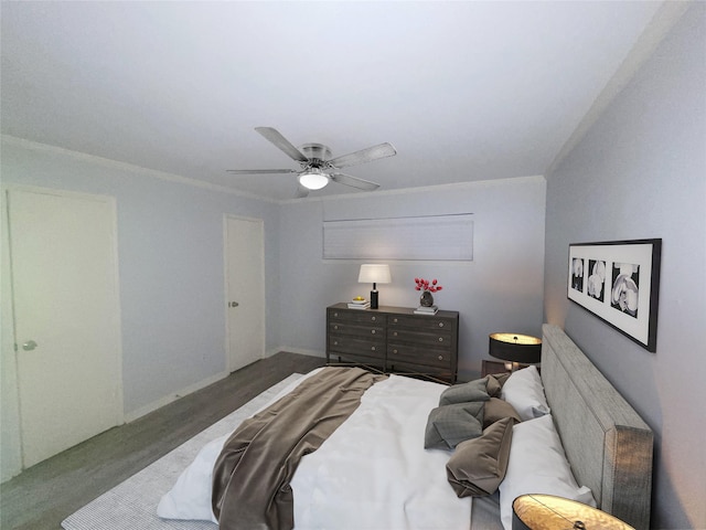 bedroom featuring carpet floors, ornamental molding, and ceiling fan