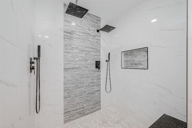 bathroom with a tile shower