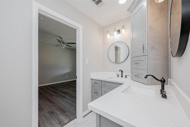 bathroom featuring vanity and ceiling fan