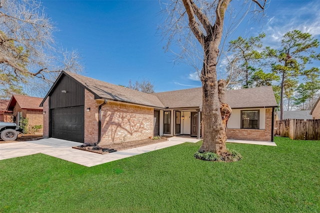 ranch-style home featuring a garage and a front yard