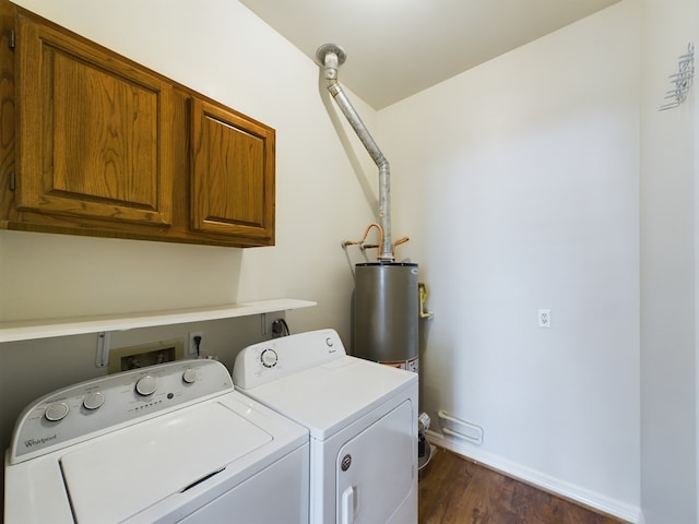 laundry room with cabinets, dark wood-type flooring, washer and clothes dryer, and water heater