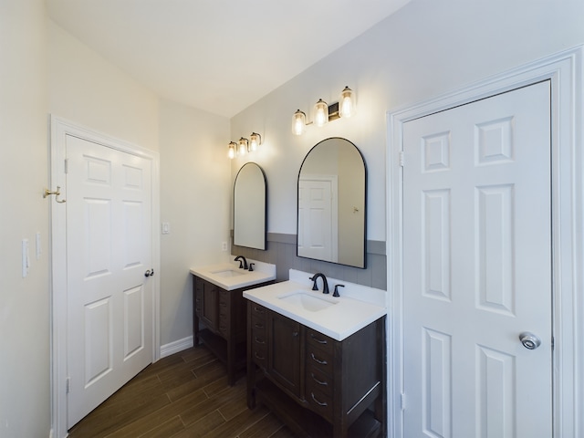 bathroom with hardwood / wood-style flooring and vanity