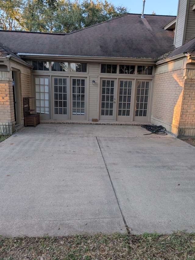 rear view of property featuring a patio area