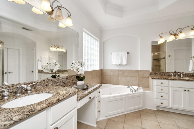 bathroom with plus walk in shower, tile patterned flooring, ornamental molding, vanity, and a tray ceiling