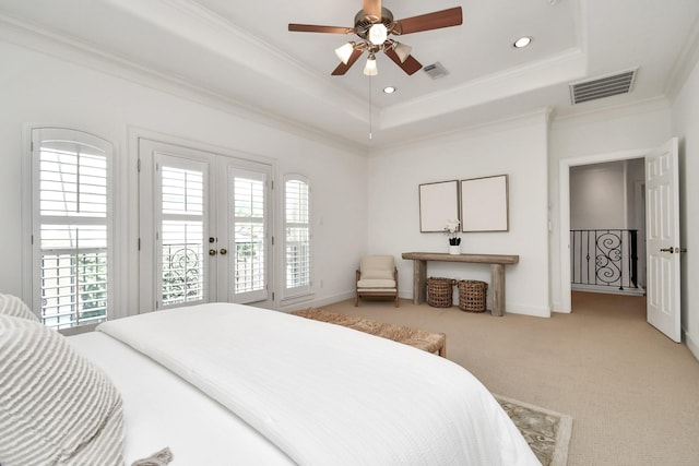 bedroom with ornamental molding, carpet, access to outside, a raised ceiling, and french doors