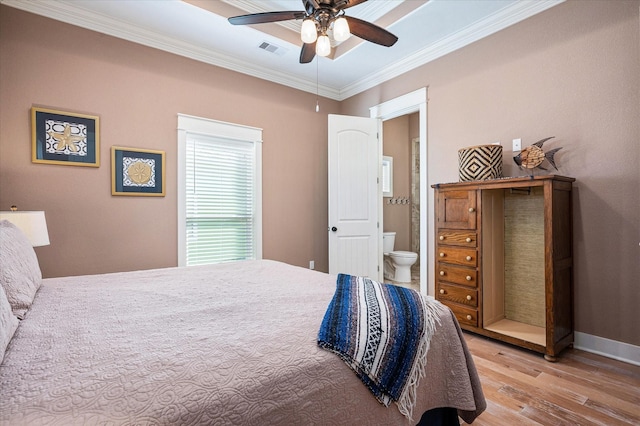 bedroom with connected bathroom, light hardwood / wood-style flooring, ornamental molding, and ceiling fan