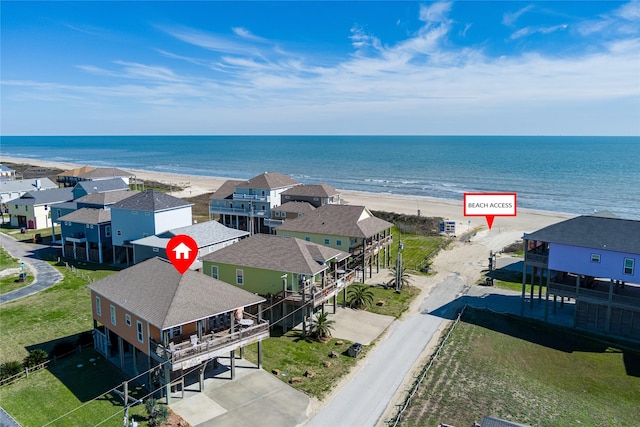 aerial view featuring a view of the beach and a water view