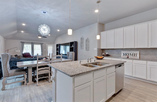 kitchen with sink, white cabinets, an island with sink, and dishwasher