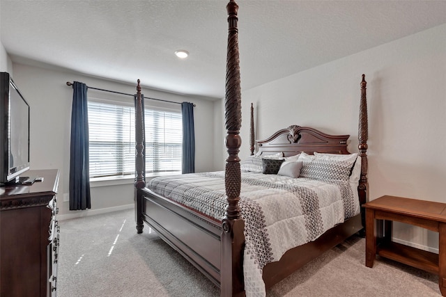 carpeted bedroom with a textured ceiling