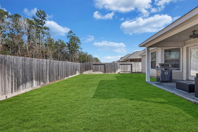 view of yard featuring ceiling fan