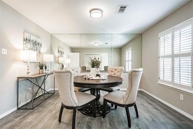 dining room with hardwood / wood-style floors