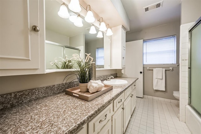 full bathroom with tile patterned flooring, vanity, a wealth of natural light, and toilet