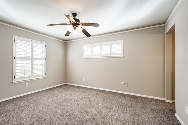 carpeted empty room with ornamental molding and ceiling fan