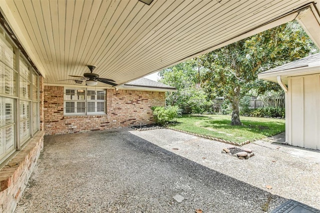 view of patio featuring ceiling fan