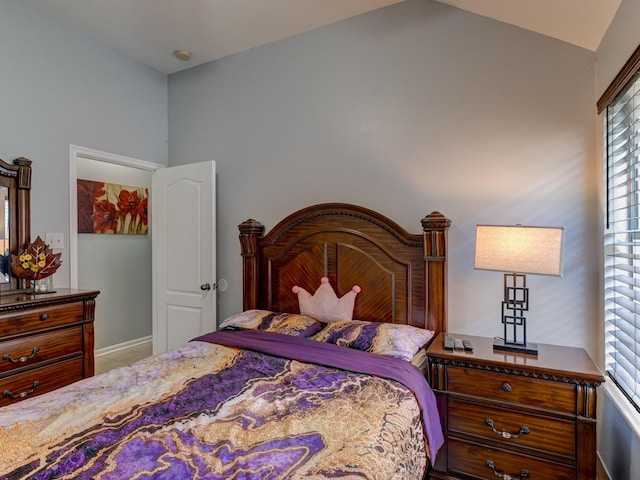 bedroom featuring vaulted ceiling