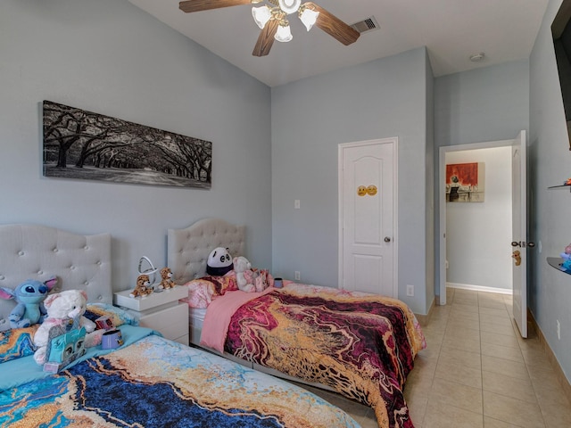 bedroom with light tile patterned floors and ceiling fan