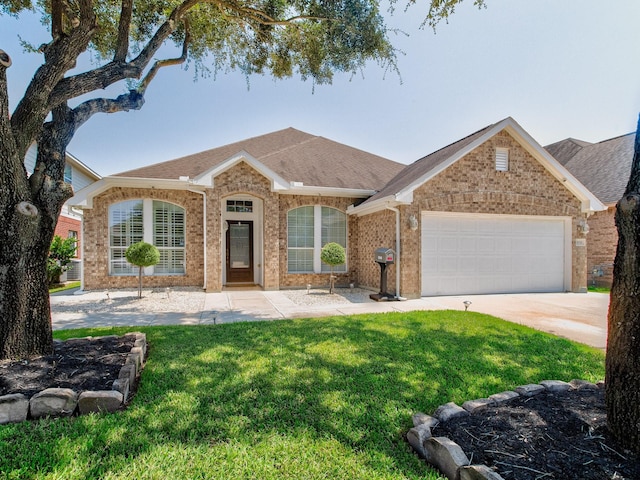 ranch-style house featuring a garage and a front yard