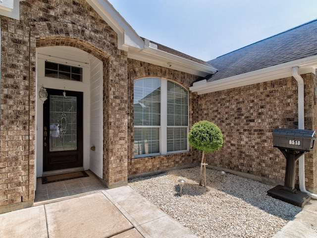 entrance to property featuring a patio area