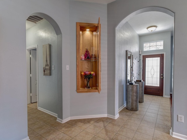 foyer with light tile patterned floors