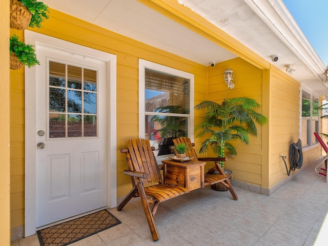 property entrance featuring a porch