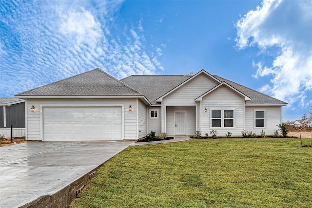 ranch-style home with a garage and a front lawn