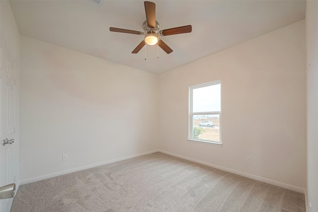 empty room featuring ceiling fan and carpet flooring