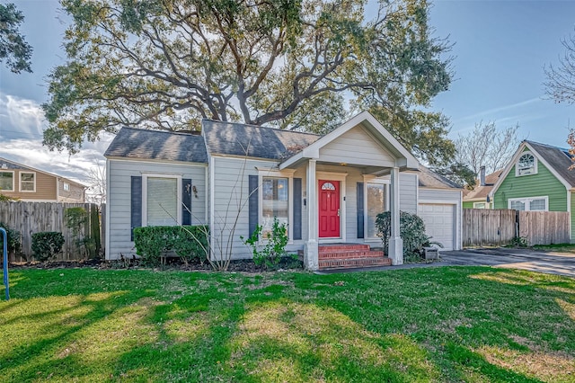 view of front facade with a garage and a front lawn