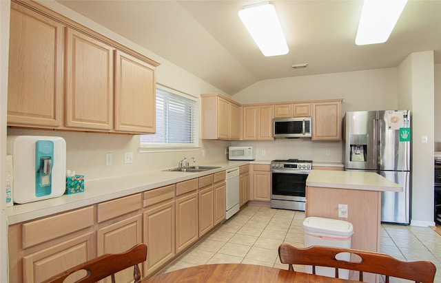 kitchen featuring sink, appliances with stainless steel finishes, a center island, light tile patterned flooring, and light brown cabinets