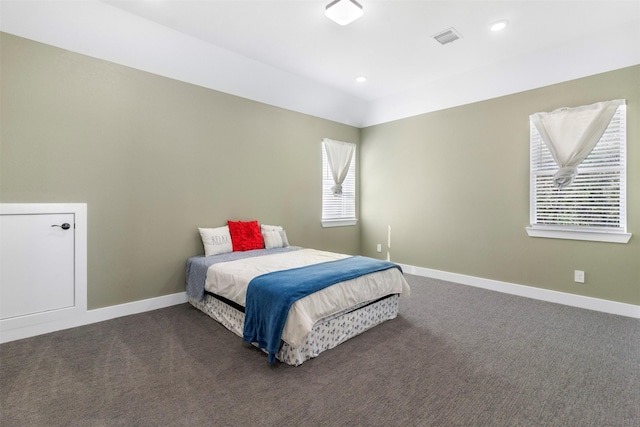 bedroom featuring dark colored carpet