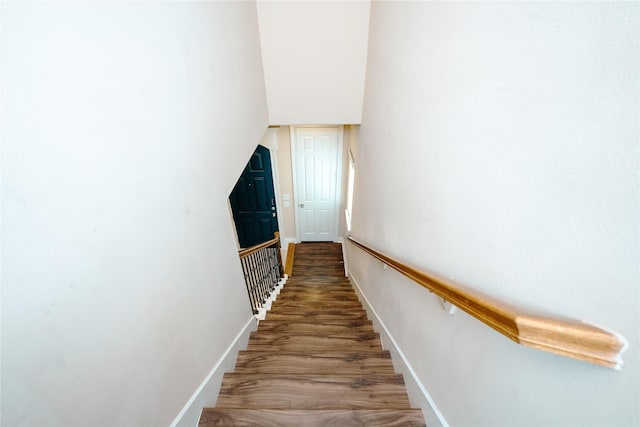 staircase featuring hardwood / wood-style floors