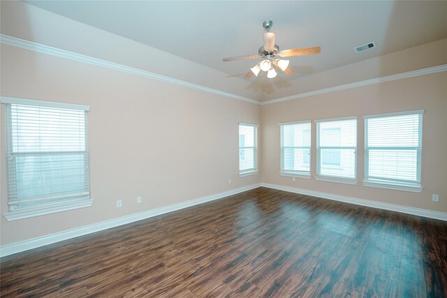 empty room with crown molding, dark hardwood / wood-style floors, and ceiling fan