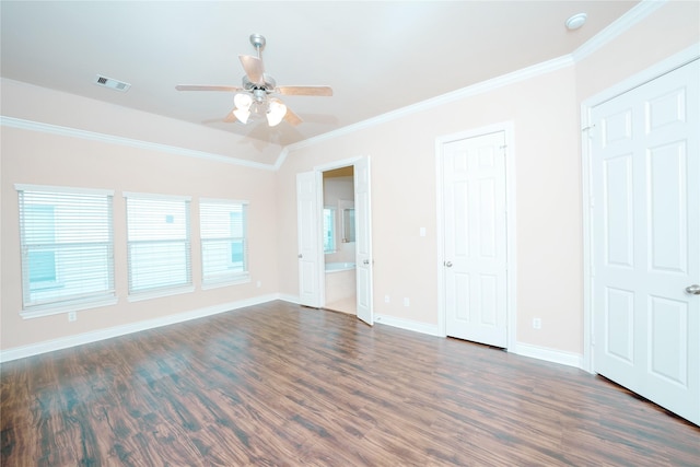 unfurnished bedroom featuring crown molding, ceiling fan, dark hardwood / wood-style flooring, and ensuite bath