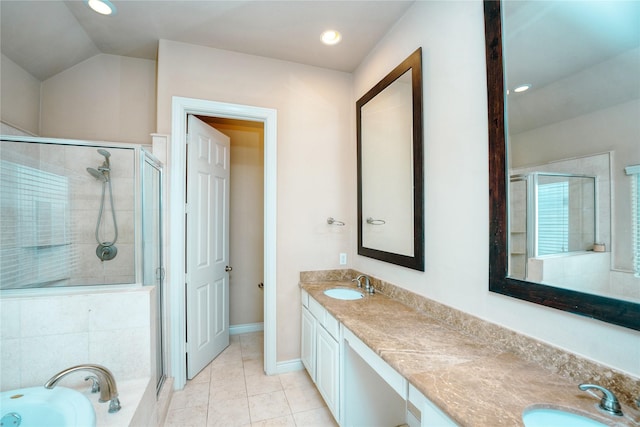 bathroom featuring vanity, vaulted ceiling, tile patterned floors, and plus walk in shower