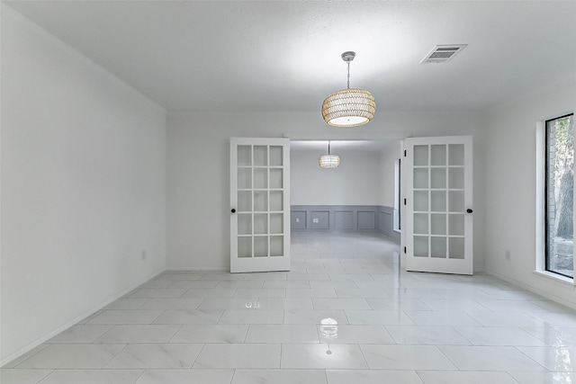 spare room with french doors