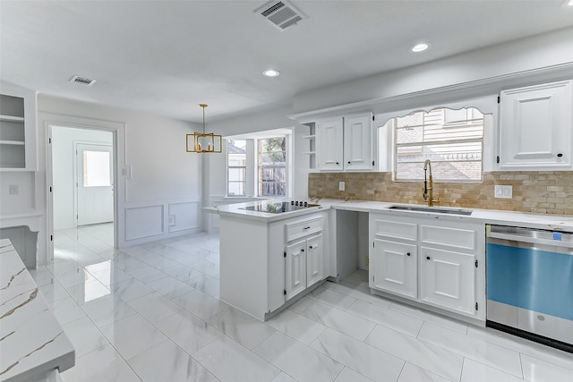 kitchen with sink, dishwasher, hanging light fixtures, white cabinets, and black electric cooktop