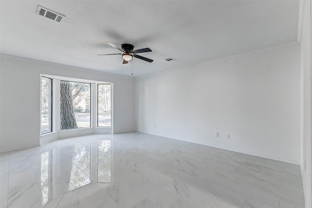 spare room with ceiling fan