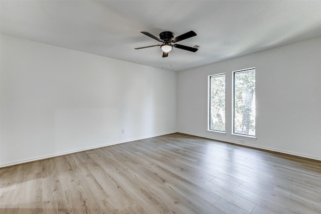 empty room featuring light hardwood / wood-style floors and ceiling fan