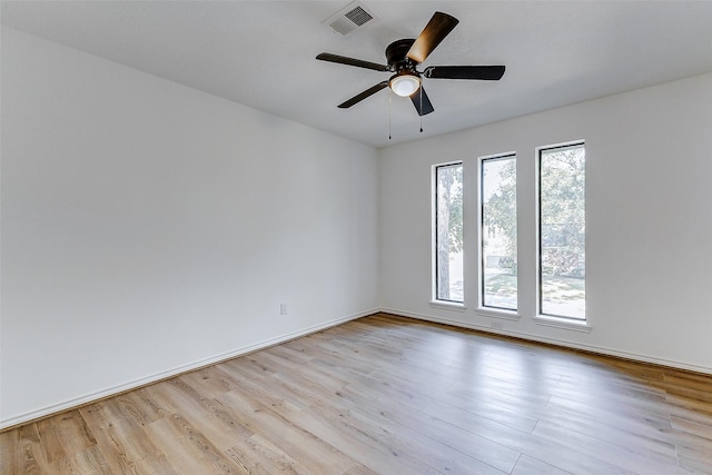 unfurnished room featuring light hardwood / wood-style flooring and ceiling fan