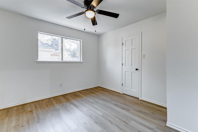 unfurnished room with ceiling fan and light hardwood / wood-style flooring