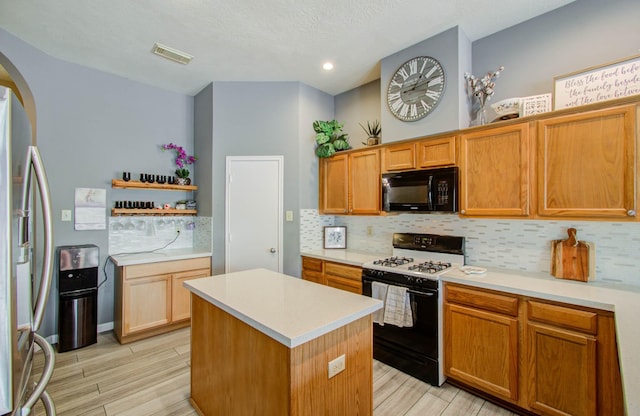 kitchen with stainless steel refrigerator with ice dispenser, gas range, a kitchen island, and backsplash