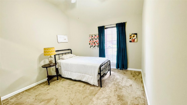 bedroom featuring light colored carpet