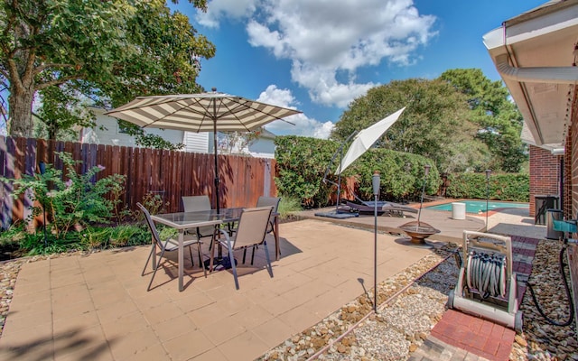 view of patio / terrace featuring a fenced in pool