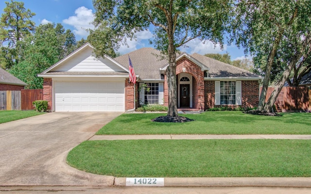 view of front of house featuring a garage and a front yard