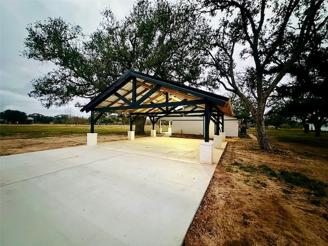 surrounding community featuring a gazebo and a lawn