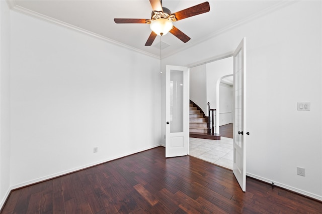 unfurnished room featuring wood-type flooring, ornamental molding, and ceiling fan